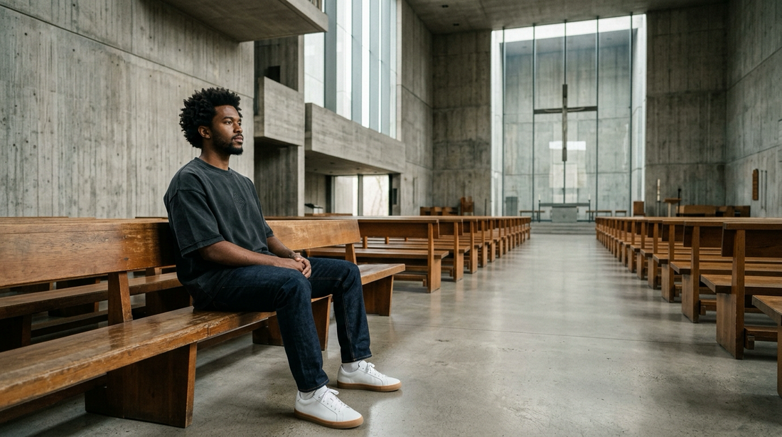 First time church visitor sitting thoughtfully in modern architectural pew sanctuary